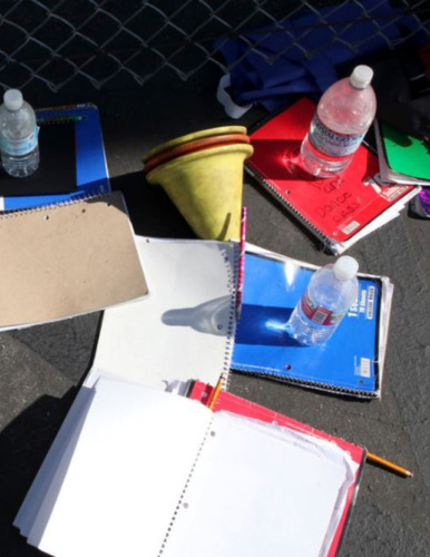 school supplies scattered on a blacktop