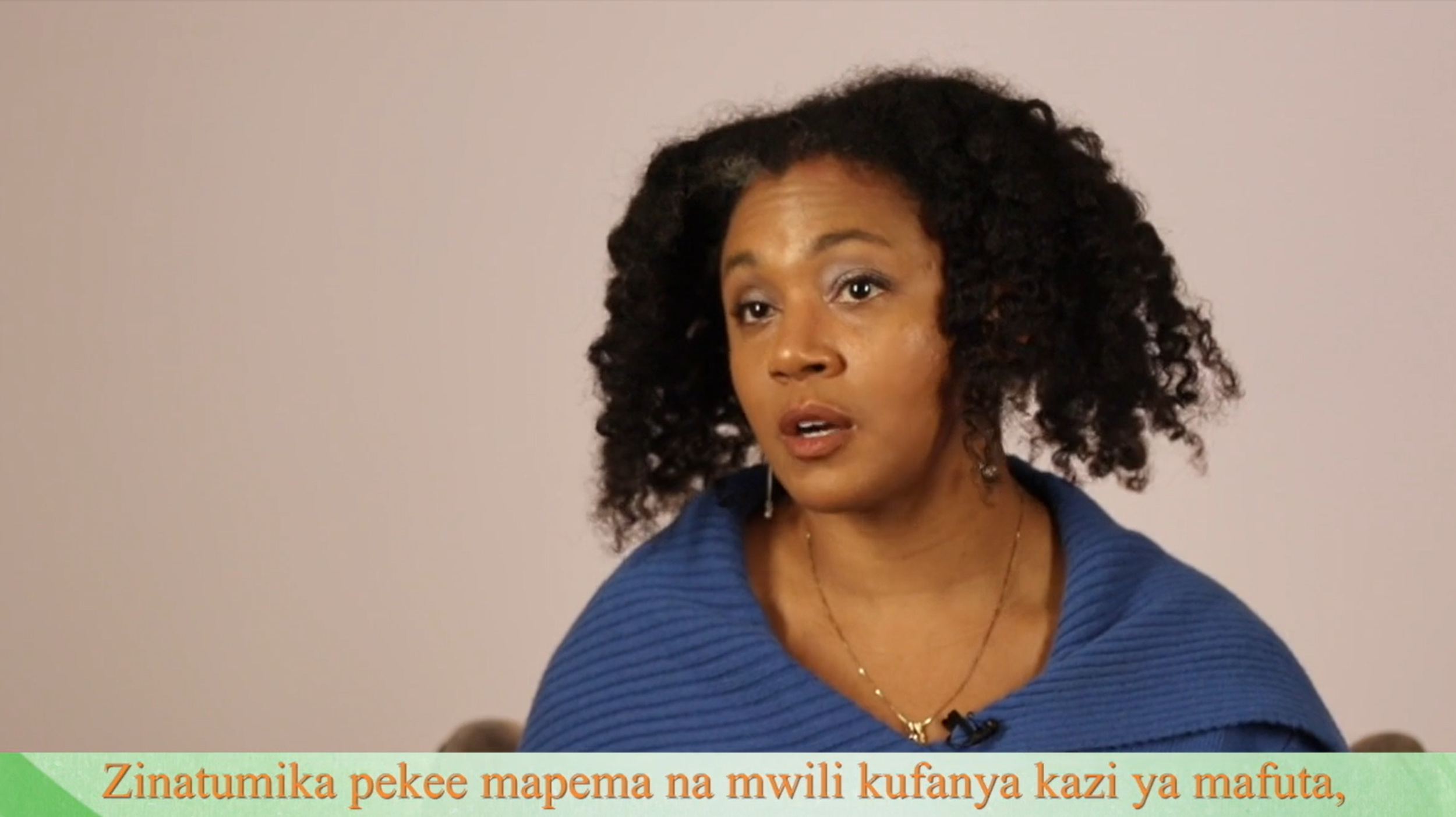 an African American woman with Swahili captions