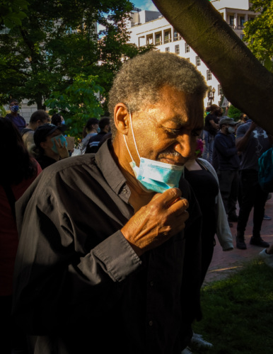 an older African American man wearing a medical mask
