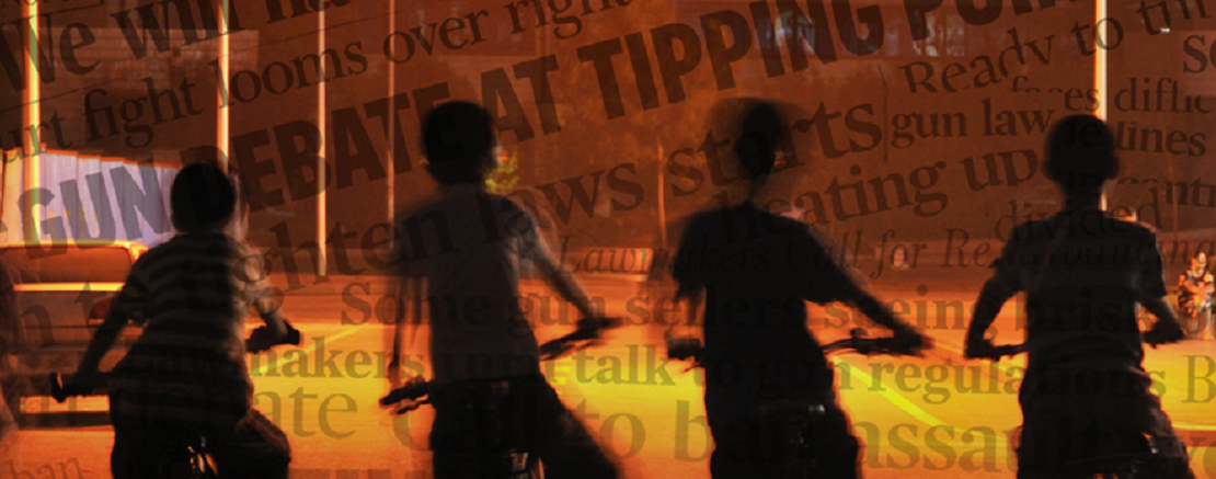 Children on bikes with flame background showing newspaper headlines about gun violence