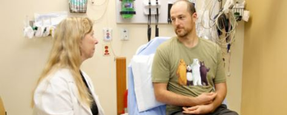 a patient seeing a physician in a hospital emergency department