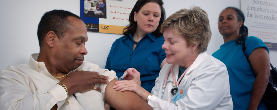 a man getting a vaccine shot