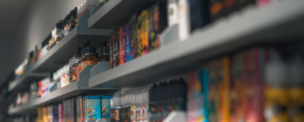 store shelves with many flavored e-liquids