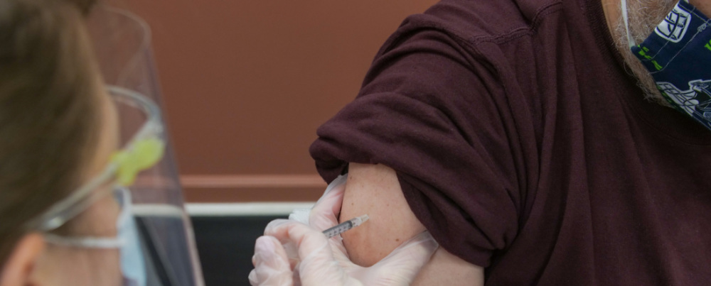 a man receiving a vaccination