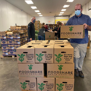 man holding foodshare box