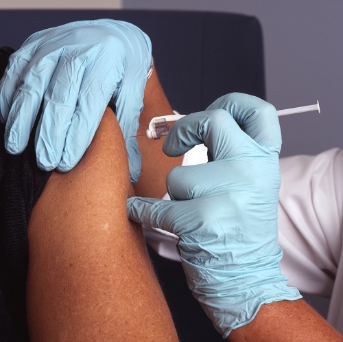 close up of a person receiving a vaccine shot