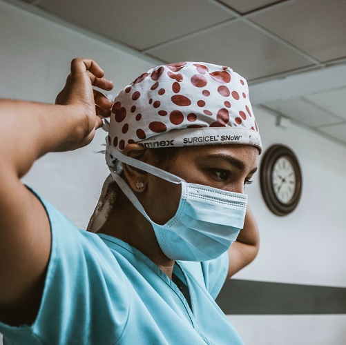 Doctor putting on a mask in an OR