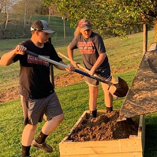 two people gardening