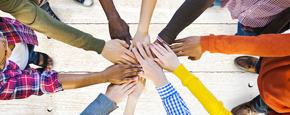 hands in a huddle