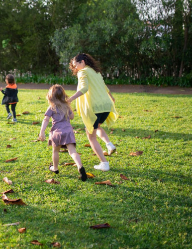 family playing in park