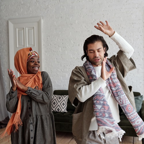 Two people dancing and clapping