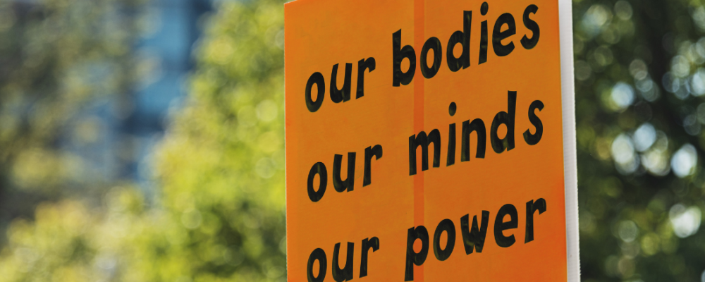 Protest sign: Our bodies, our minds, our power