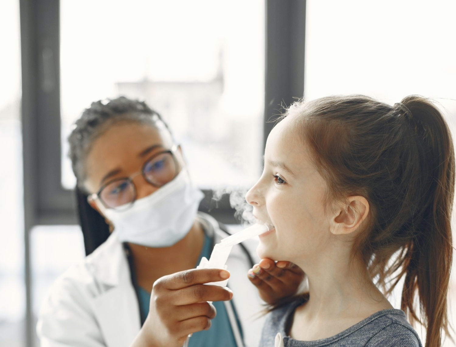 public health professional does home visit with a child who has asthma