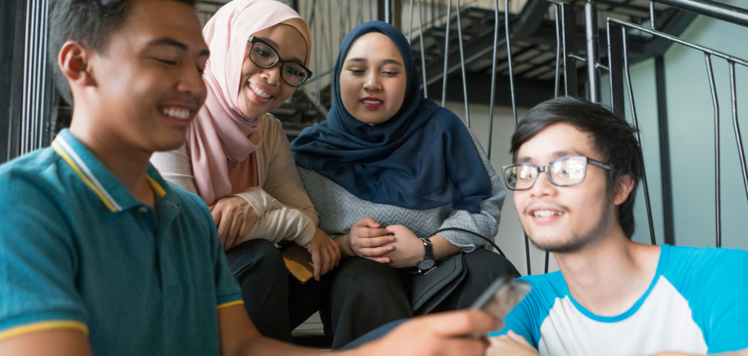 Teens sitting together