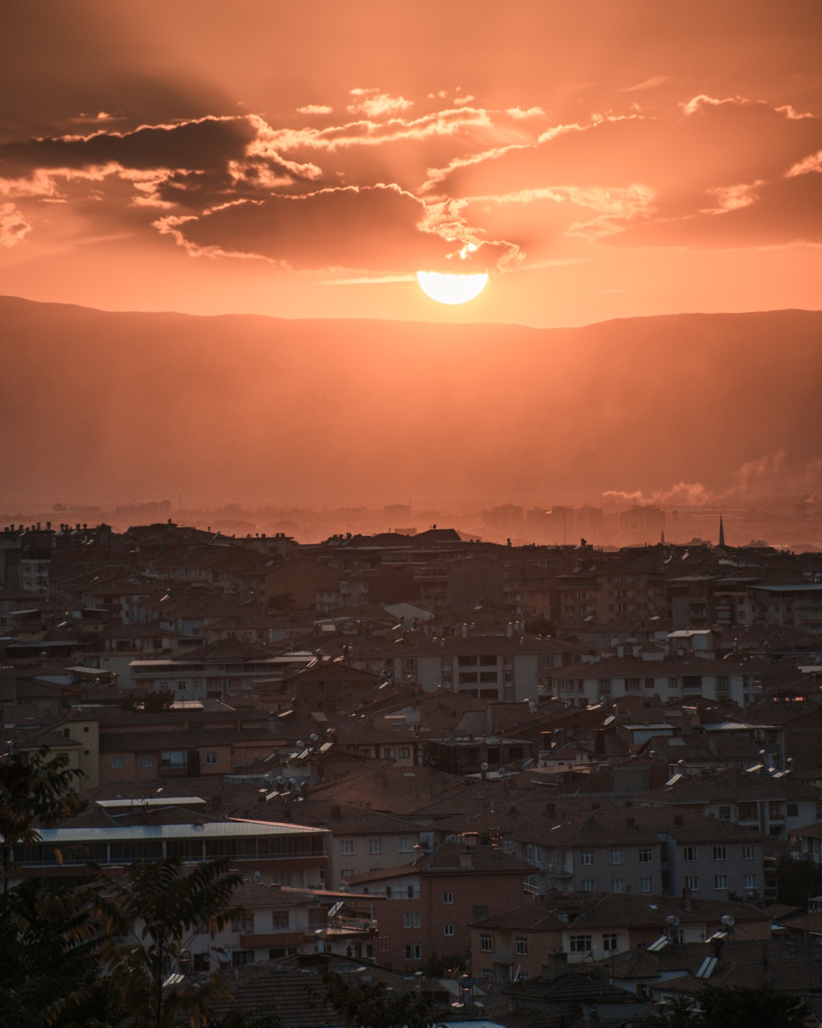 air pollution during sunset over a city