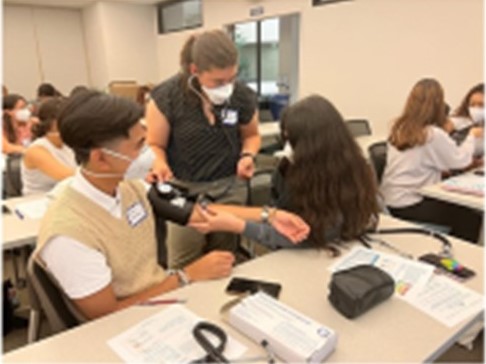 Students practicing taking blood pressure