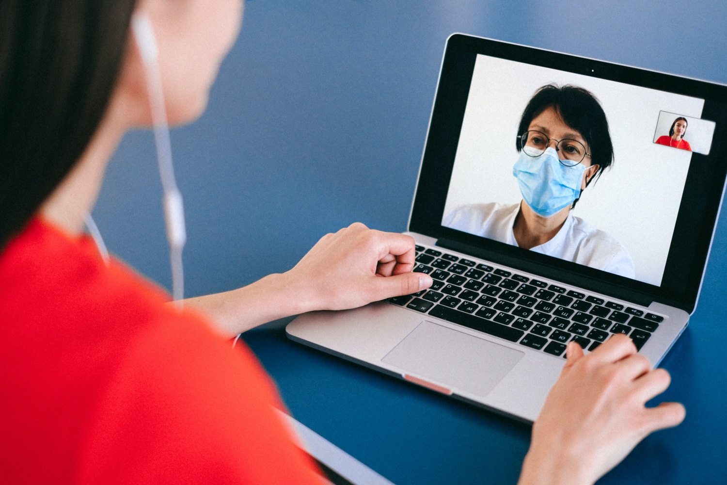 woman talking to a doctor online