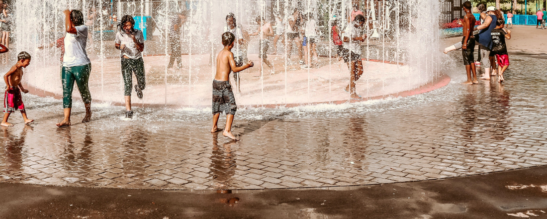 picture of kids playing in a splash pad at a park