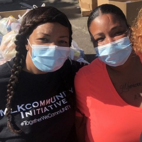 Two women wearing masks