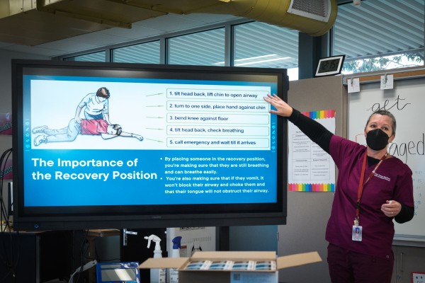 School nurse Abby Serin teaches a workshop on opioids and the opioid overdose reversal drug naloxone to students at Hiram Johnson High School in Sacramento, California. (Heidi de Marco / KHN)