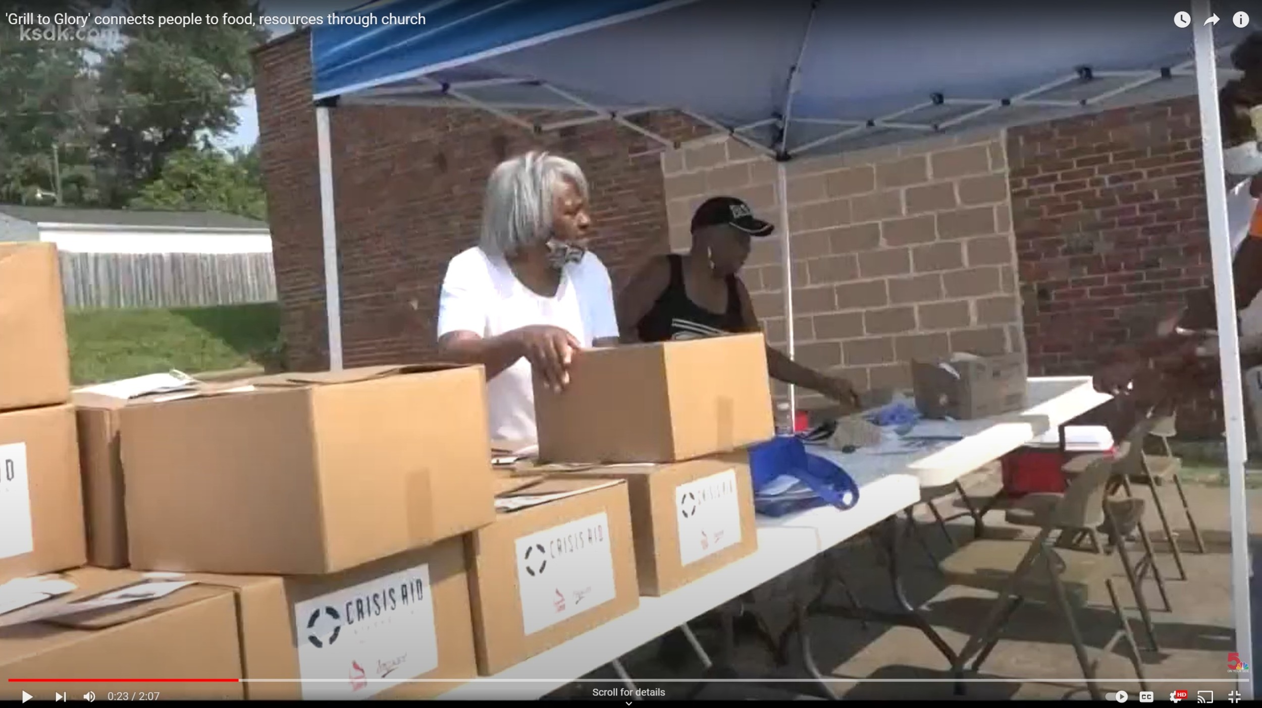 screenshot of women with boxes at church