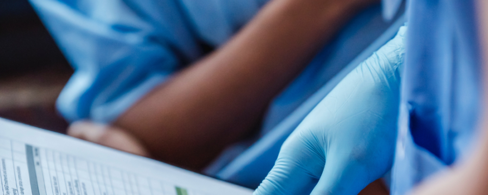 doctor reviewing chart with patient