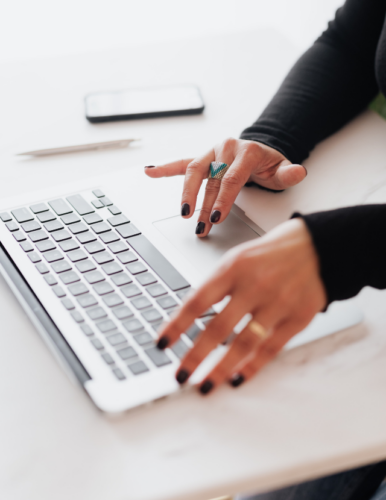 Woman typing on her computer