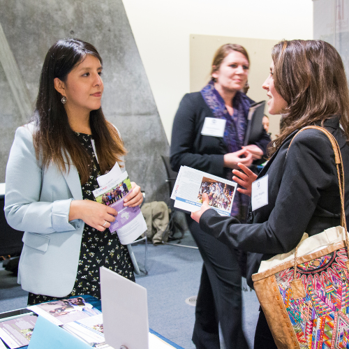 Two people in discussion at a health fair