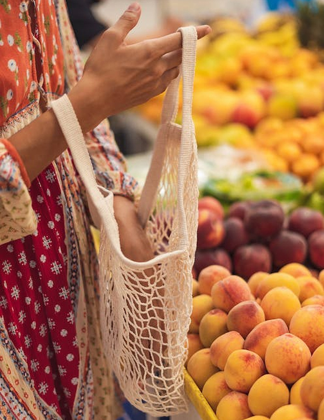 fresh produce in reusable woven bag