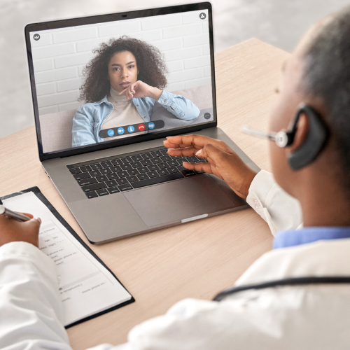 Doctor and patient in discussion, via a telehealth appointment