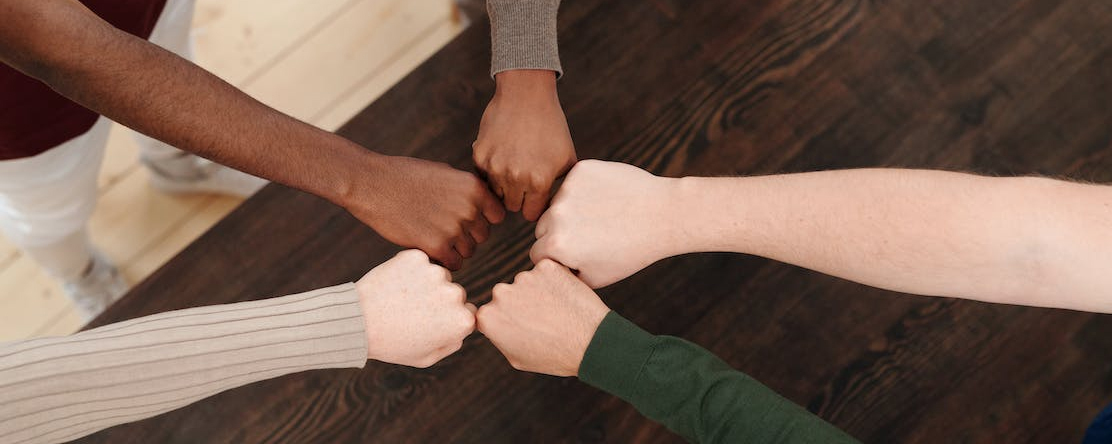 fists in huddle