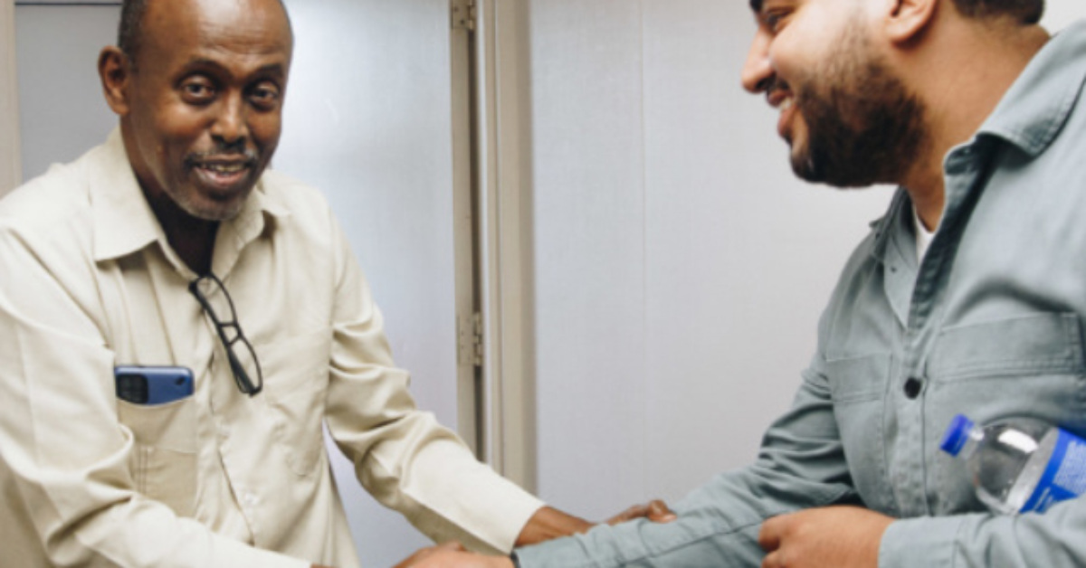 two men shaking hands