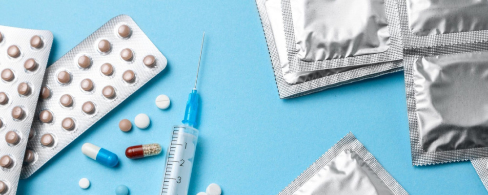 photo of syringe, pills and condoms