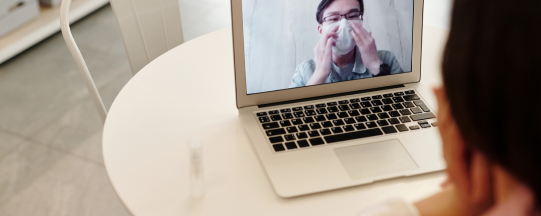 a patient talking to a doctor through a computer