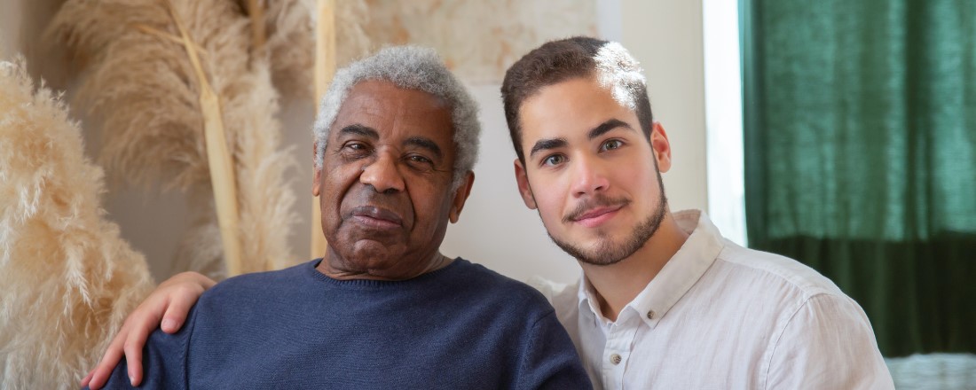 older African American male sitting next to a younger African American male