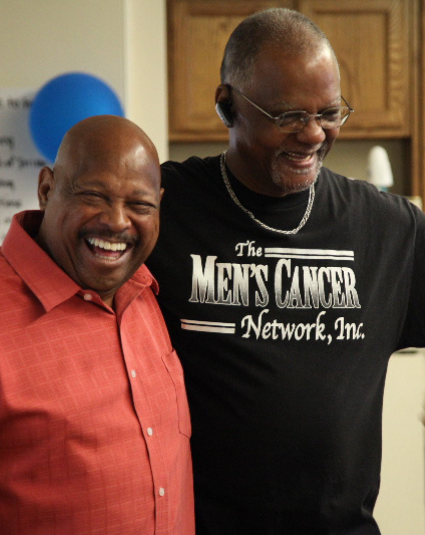 Two Black men, smiling