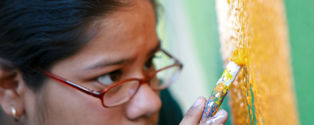 girl painting a mural