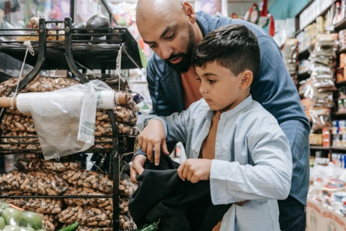 man shopping with boy