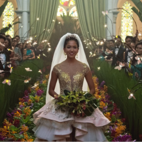 raminta Lee (Played by Sonoya Mizuno), walks down the aisle in her wedding dress in Crazy Rich Asians (2018).