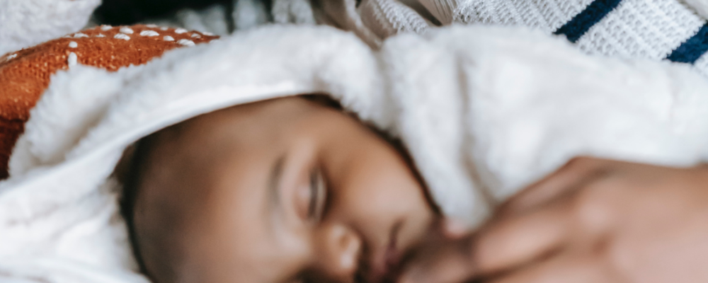 baby laying down in bed