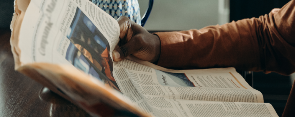 man holding newspaper