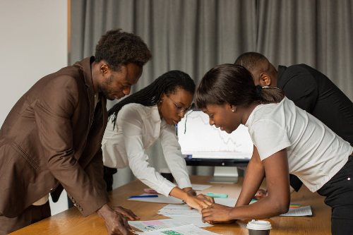 people collaborating at desk