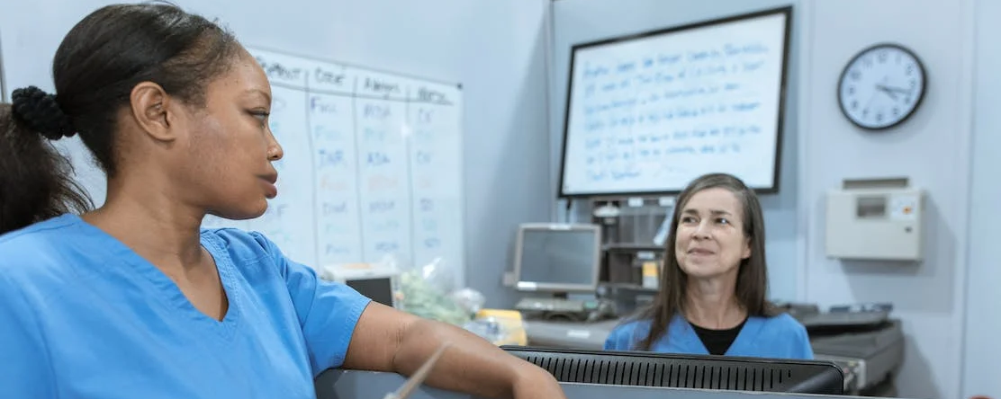 two hospital workers smiling 2