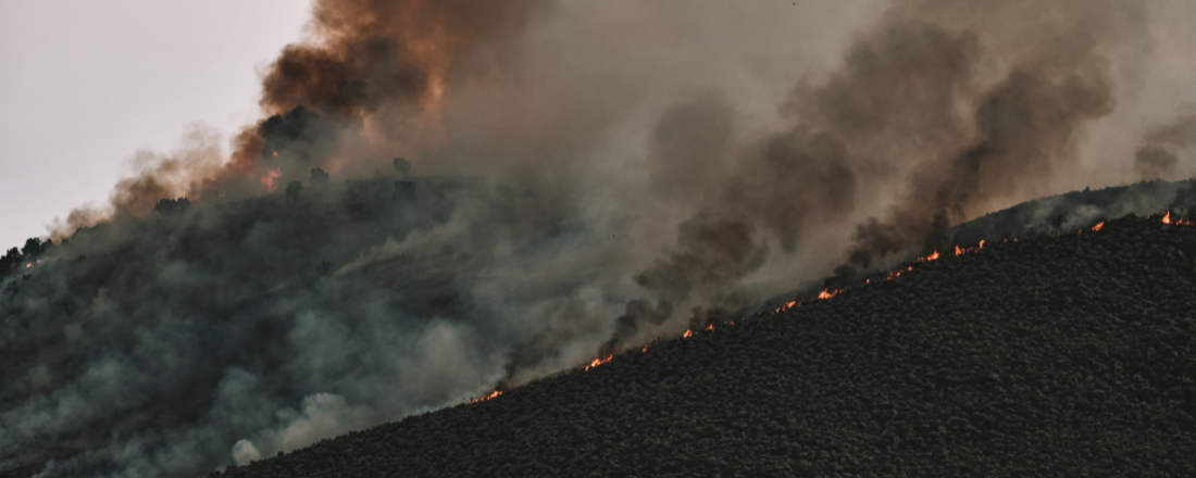 fire on a mountain with smoke