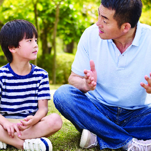 father talking to son