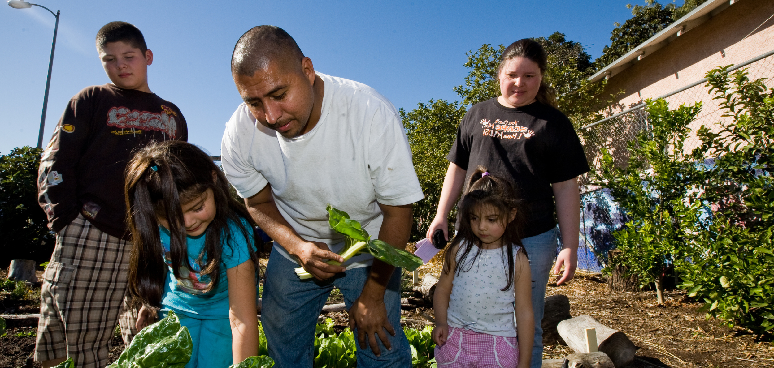Family working in an urban garden