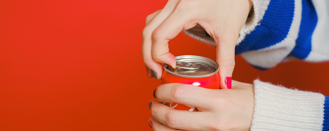 hands opening a soda can