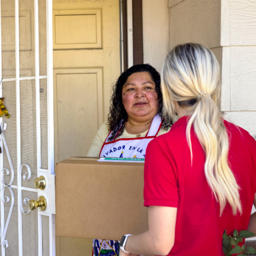 Participant in Abbott's Food as Medicine program receives food box at their front door