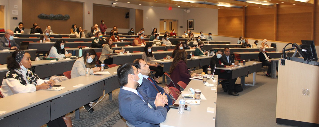 audience listening to speaker