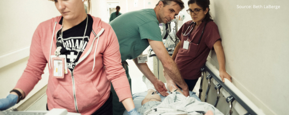 doctor and health care staff assisting patient in the emergency room